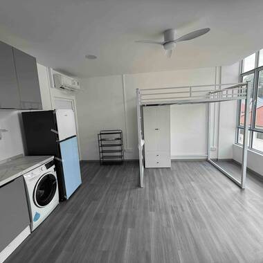 Common room with high ceiling and huge windows